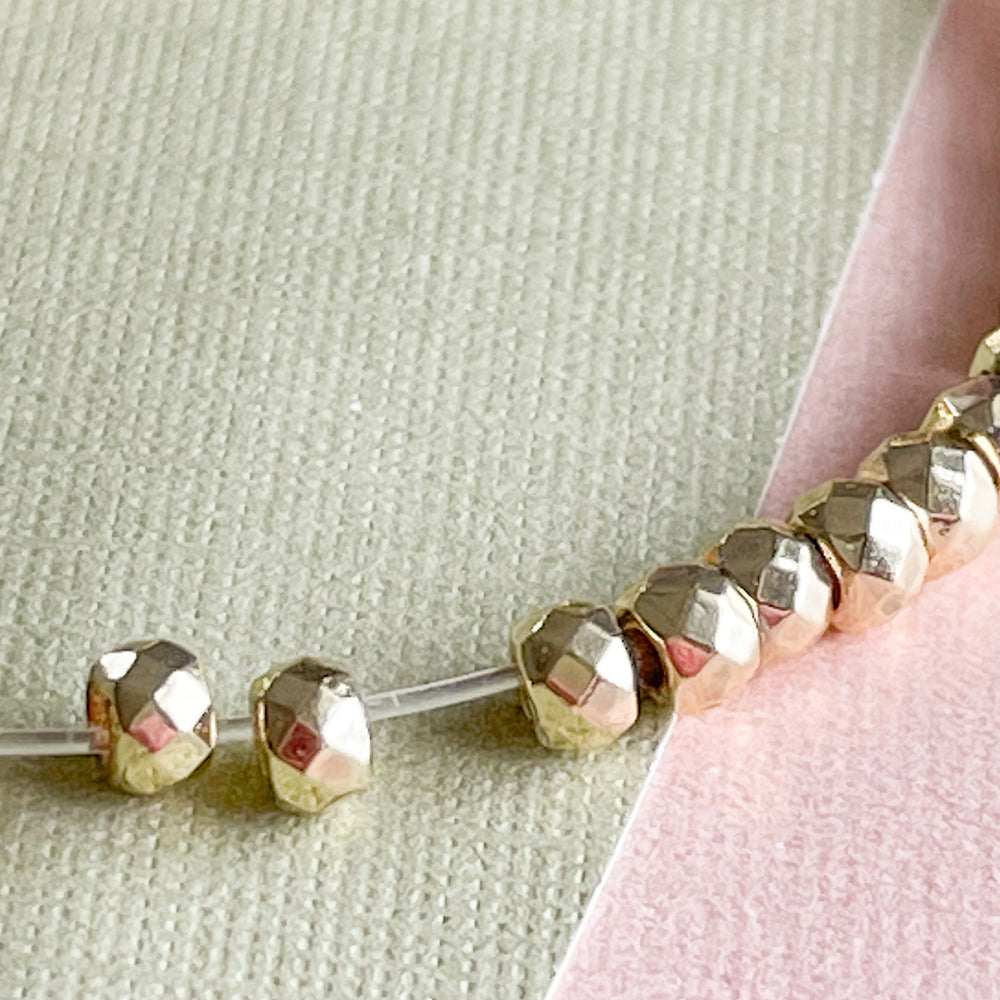 3mm Gold Faceted Hematite Rondelle Strand