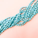 10mm Turquoise Dyed Magnesite Cross Strand - Christine White Style