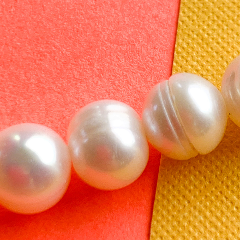 5-6mm White Freshwater Pearl Rounds Strand