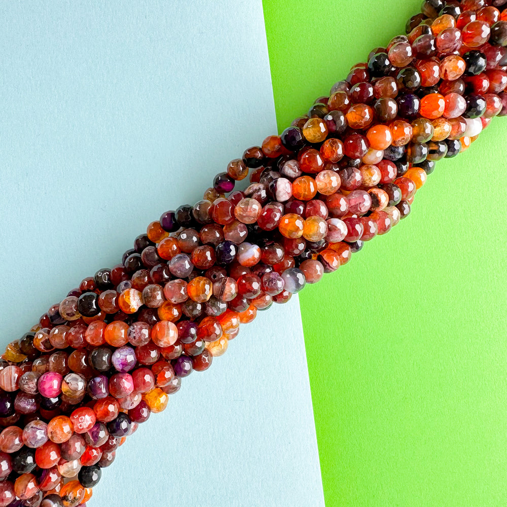 
                
                    Load image into Gallery viewer, 6mm Fire Moon Agate Faceted Round Strand
                
            