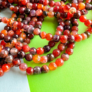 
                
                    Load image into Gallery viewer, 6mm Fire Moon Agate Faceted Round Strand
                
            