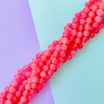 8mm Neon Pink Faceted Dyed Jade Round Strand