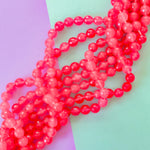 8mm Neon Pink Faceted Dyed Jade Round Strand