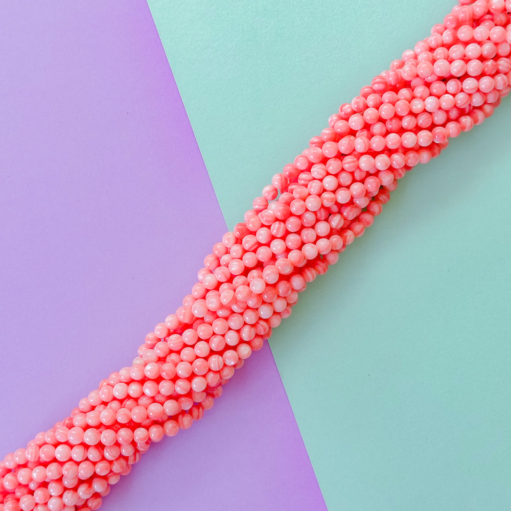 5mm Coral dyed Mother of Pearl Rounds Strand
