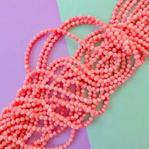 5mm Coral dyed Mother of Pearl Rounds Strand