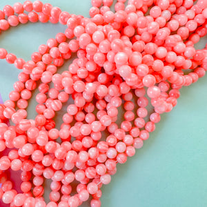 5mm Coral dyed Mother of Pearl Rounds Strand