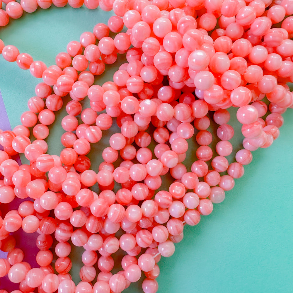 5mm Coral dyed Mother of Pearl Rounds Strand