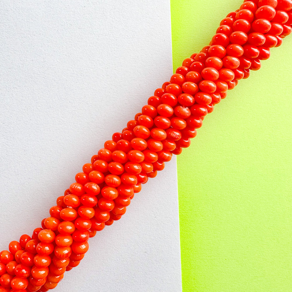 
                
                    Load image into Gallery viewer, 7mm Orange Bamboo Coral Rondelle Strand
                
            
