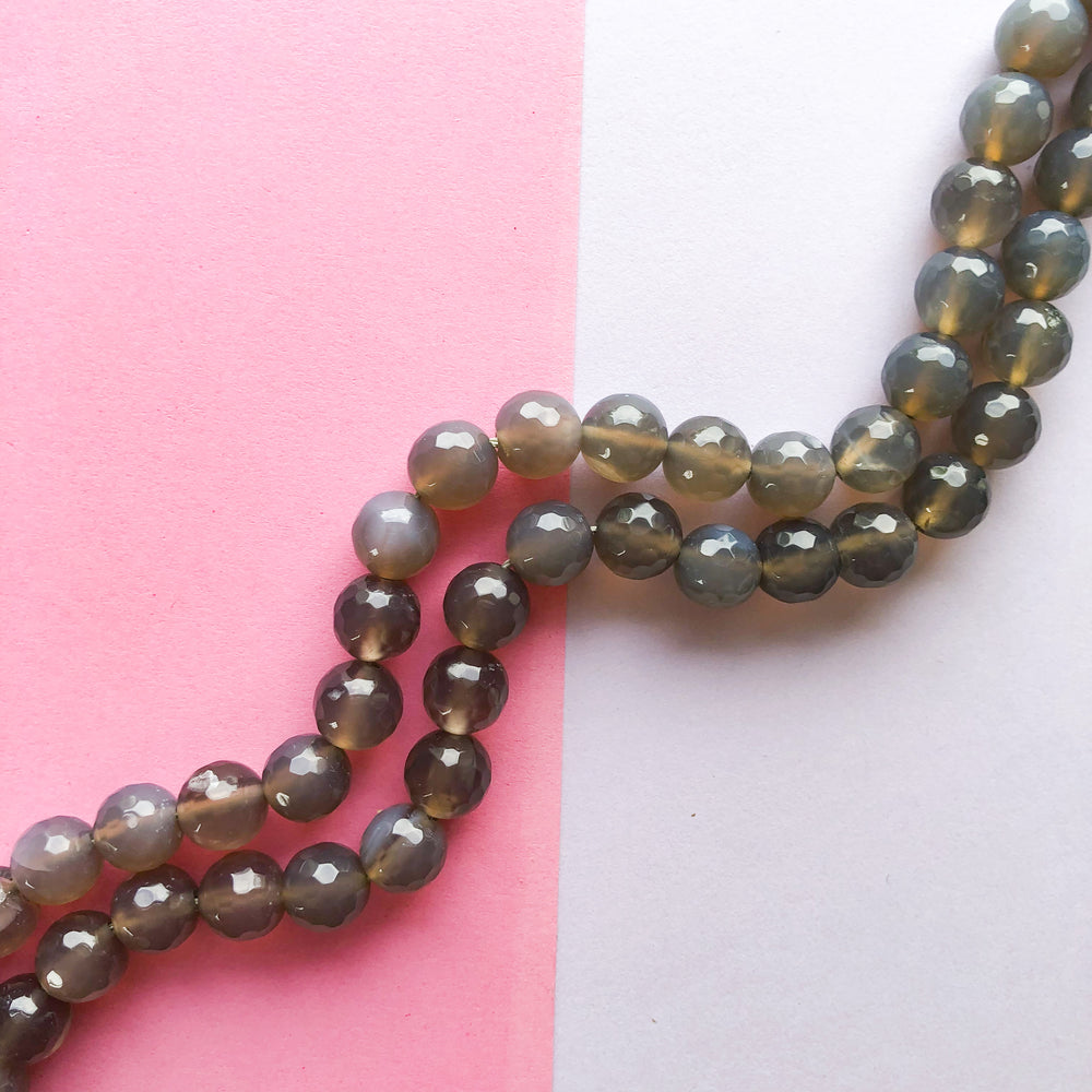 
                
                    Load image into Gallery viewer, 10mm Grey Translucent Agate Faceted Round Strand
                
            