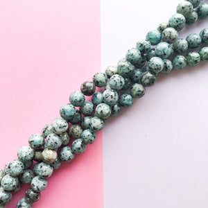 
                
                    Load image into Gallery viewer, 10mm Smooth Turquoise Spotted Jade Round Strand
                
            
