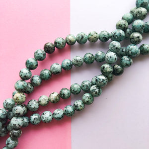 
                
                    Load image into Gallery viewer, 10mm Smooth Turquoise Spotted Jade Round Strand
                
            