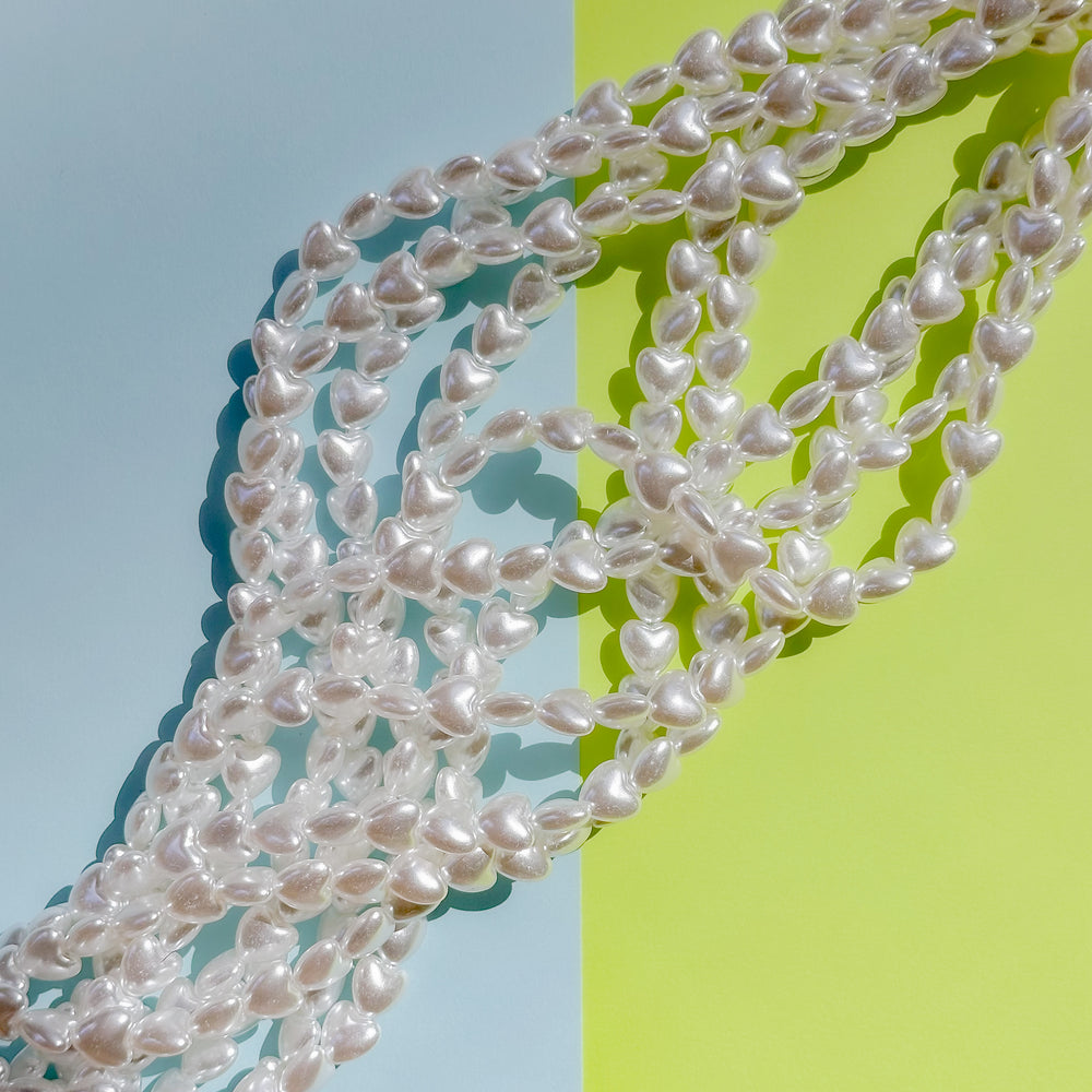10mm White Coated Resin Pearl Heart Strand