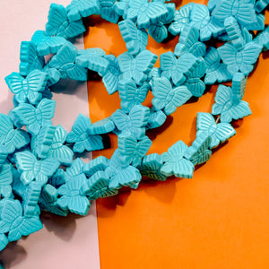 22mm Turquoise Carved Magnesite Butterfly Bead Strand