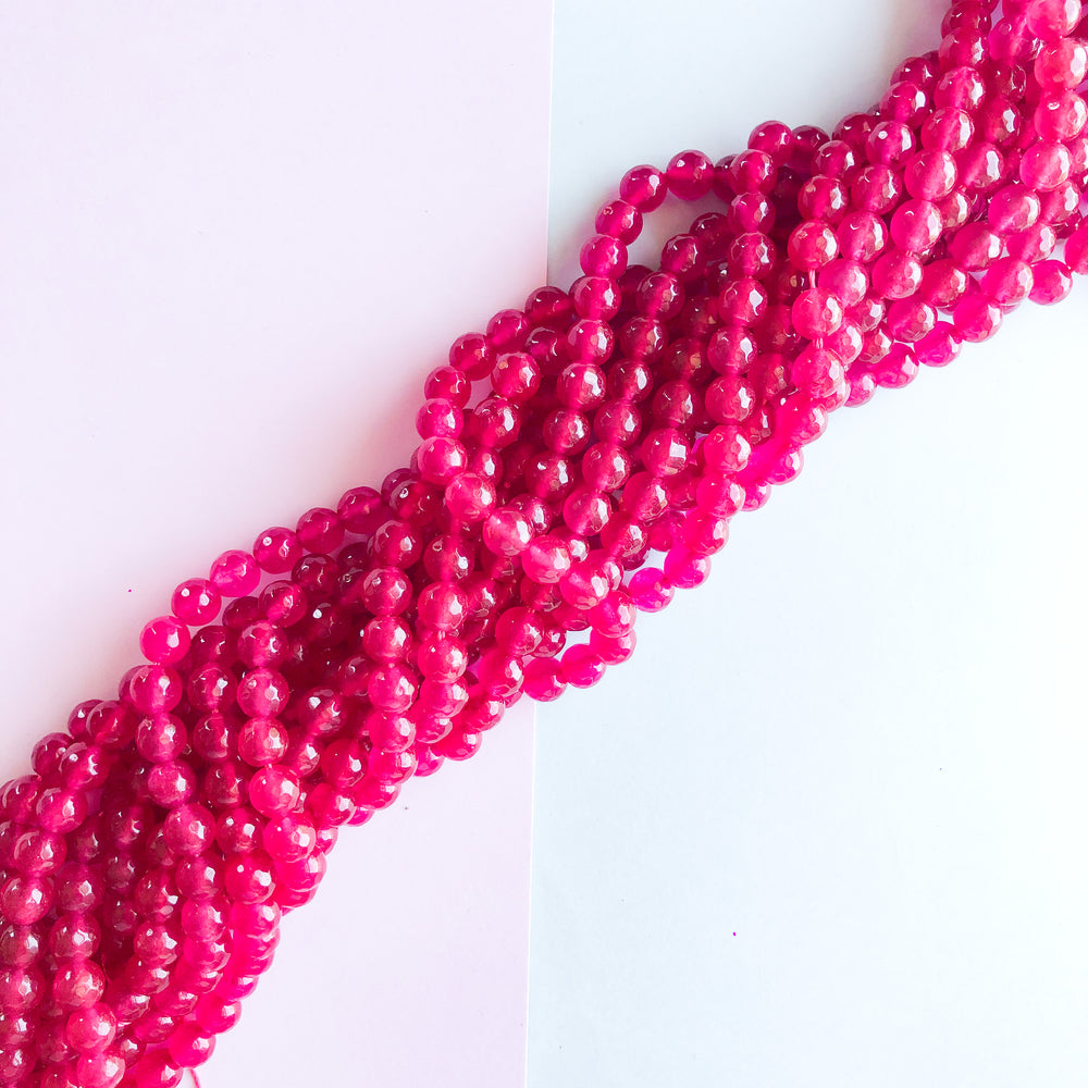 
                
                    Load image into Gallery viewer, 8mm Hot Pink Dyed Jade Faceted Rounds Strand
                
            