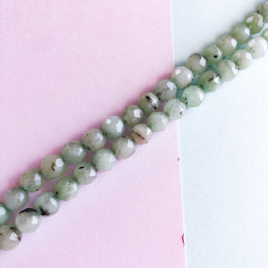 
                
                    Load image into Gallery viewer, 6mm Spotted Light Teal Faceted Agate Round Strand
                
            