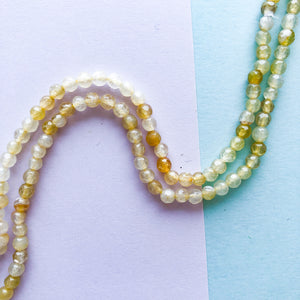 
                
                    Load image into Gallery viewer, 4mm Banana Faceted Agate Round Strand
                
            