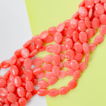 14mm Coral Dyed Calcite Flat Oval Strand