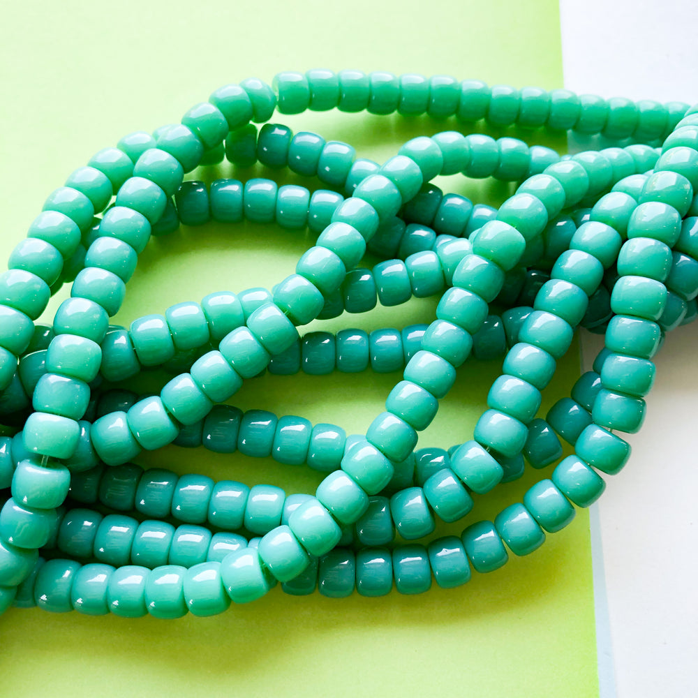 
                
                    Load image into Gallery viewer, 8mm Turtle Green Glass Roller Strand
                
            