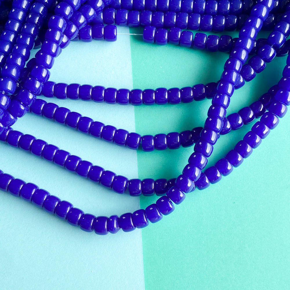 
                
                    Load image into Gallery viewer, 8mm Translucent Cobalt Glass Roller Strand
                
            
