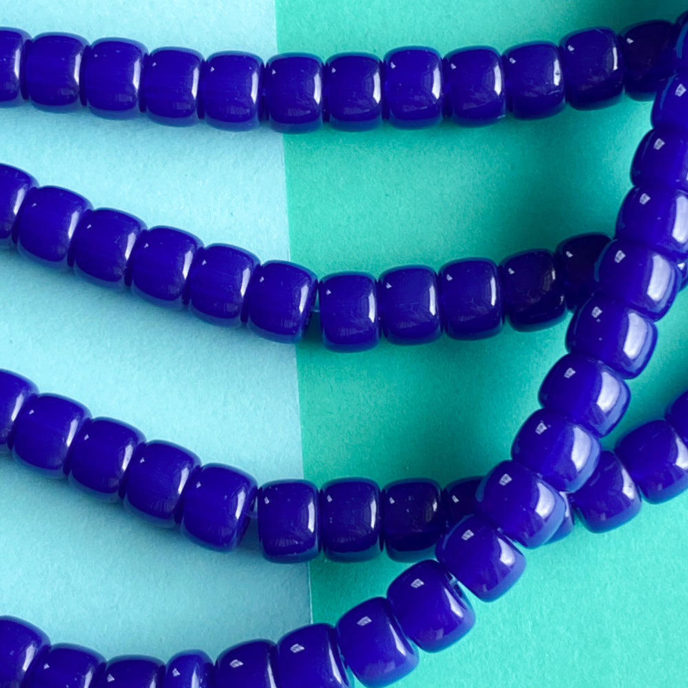 
                
                    Load image into Gallery viewer, 8mm Translucent Cobalt Glass Roller Strand
                
            