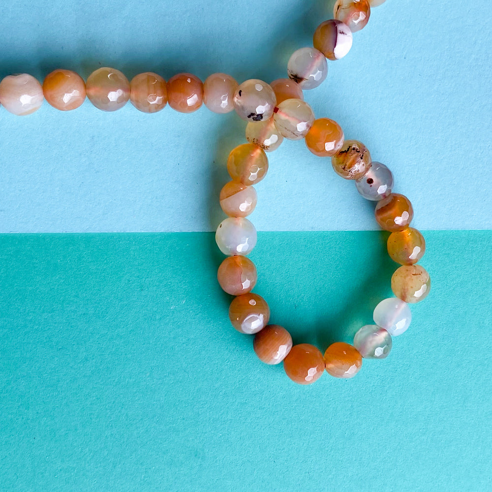 8mm Faceted Carnelian Rounds Strand