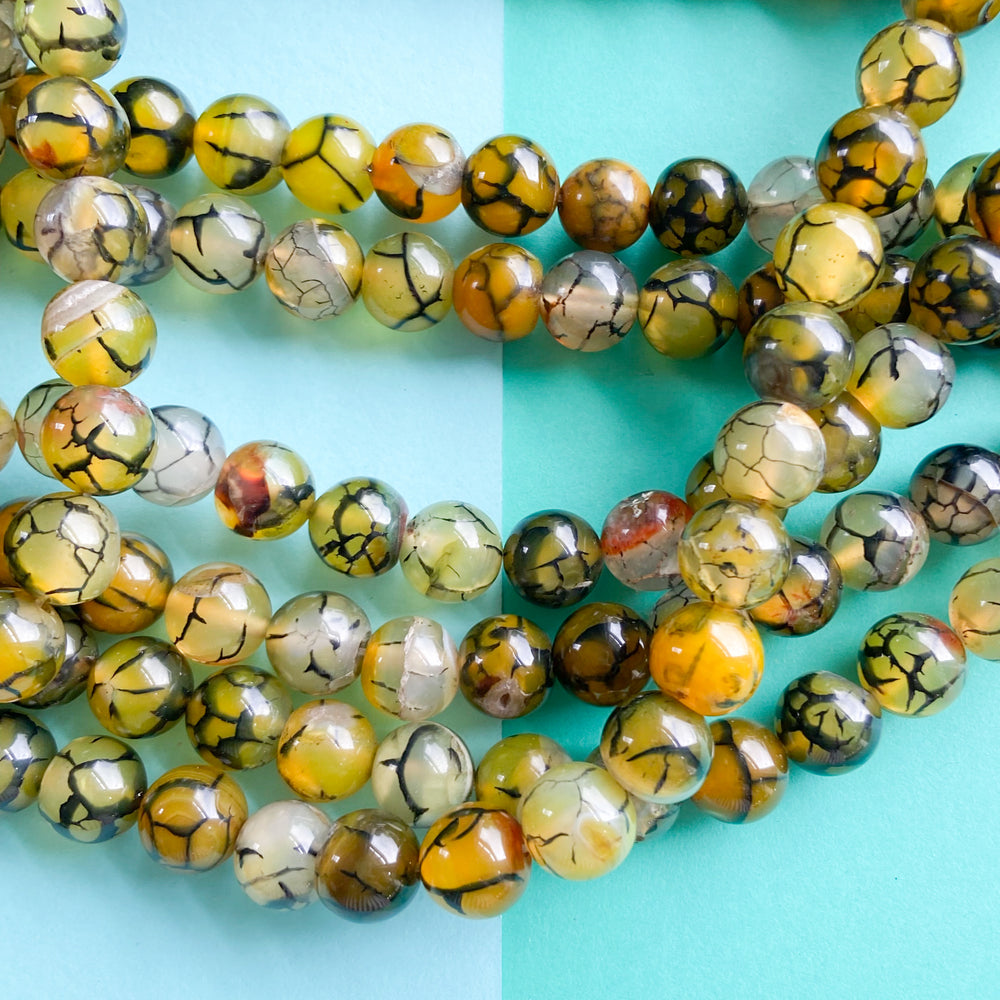 
                
                    Load image into Gallery viewer, 10mm Kelp Crackle Agate Rounds Strand
                
            