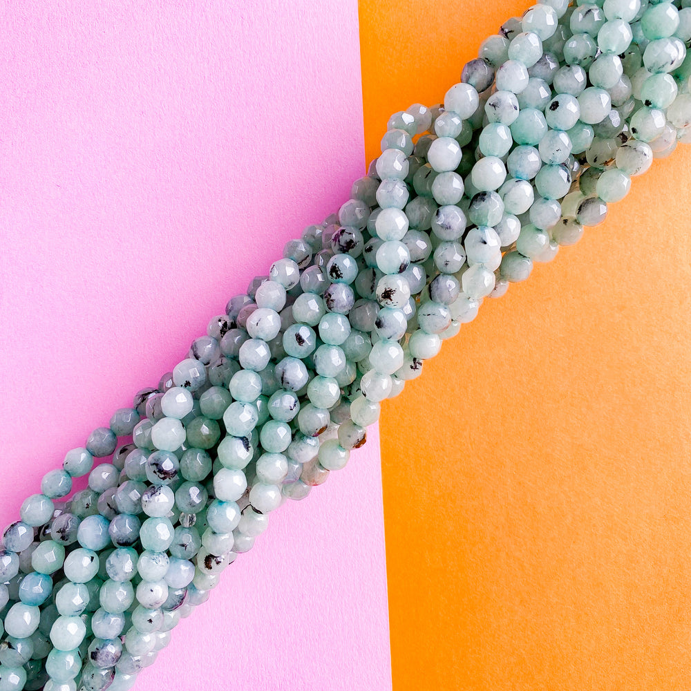6mm Aqua Dyed Spotted Jade Faceted Round Strand