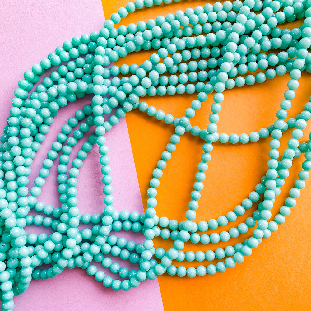 Turquoise Colcite 6mm Smooth Turquoise Dyed Calcite Rounds Strand – Beads, Inc.