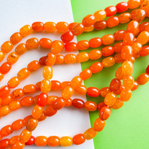 
                
                    Load image into Gallery viewer, 12mm Bright Orange Dyed Agate Barrel Strand
                
            