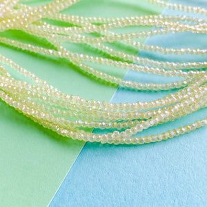 
                
                    Load image into Gallery viewer, 2mm Buttercream Faceted Chinese Crystal Rondelle Strand
                
            