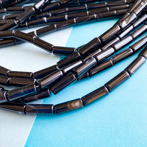 
                
                    Load image into Gallery viewer, 6mm Black Banded Agate Barrel Strand
                
            