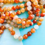 18mm Mixed Orange Agate Faceted Rounds Strand