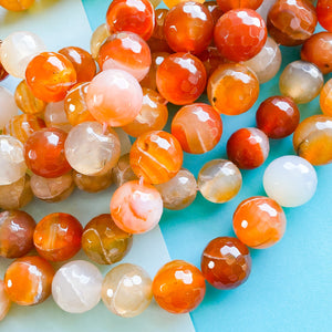 
                
                    Load image into Gallery viewer, 18mm Mixed Orange Agate Faceted Rounds Strand
                
            