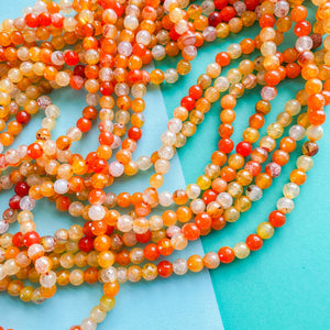 
                
                    Load image into Gallery viewer, 6mm Tangelo Orange Agate Faceted Round Strand
                
            