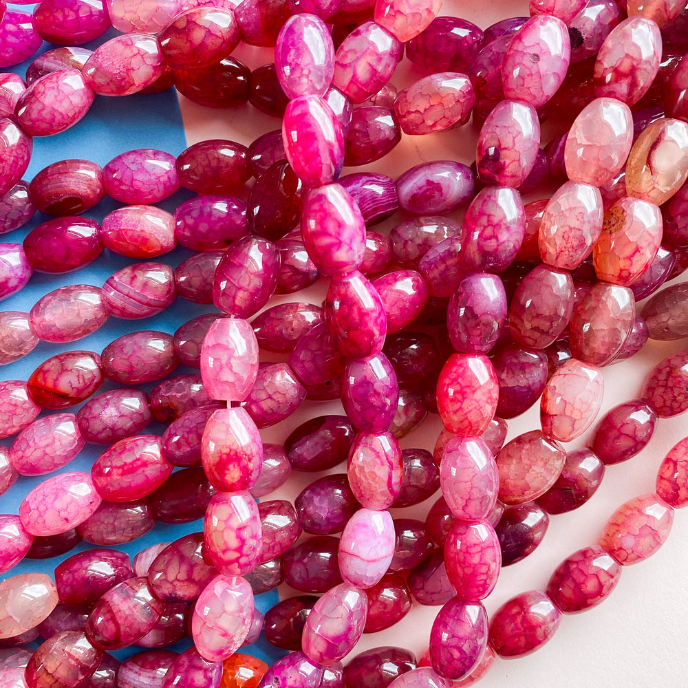 
                
                    Load image into Gallery viewer, 10mm Raspberry Pink Smooth Dyed Agate Barrel Strand
                
            