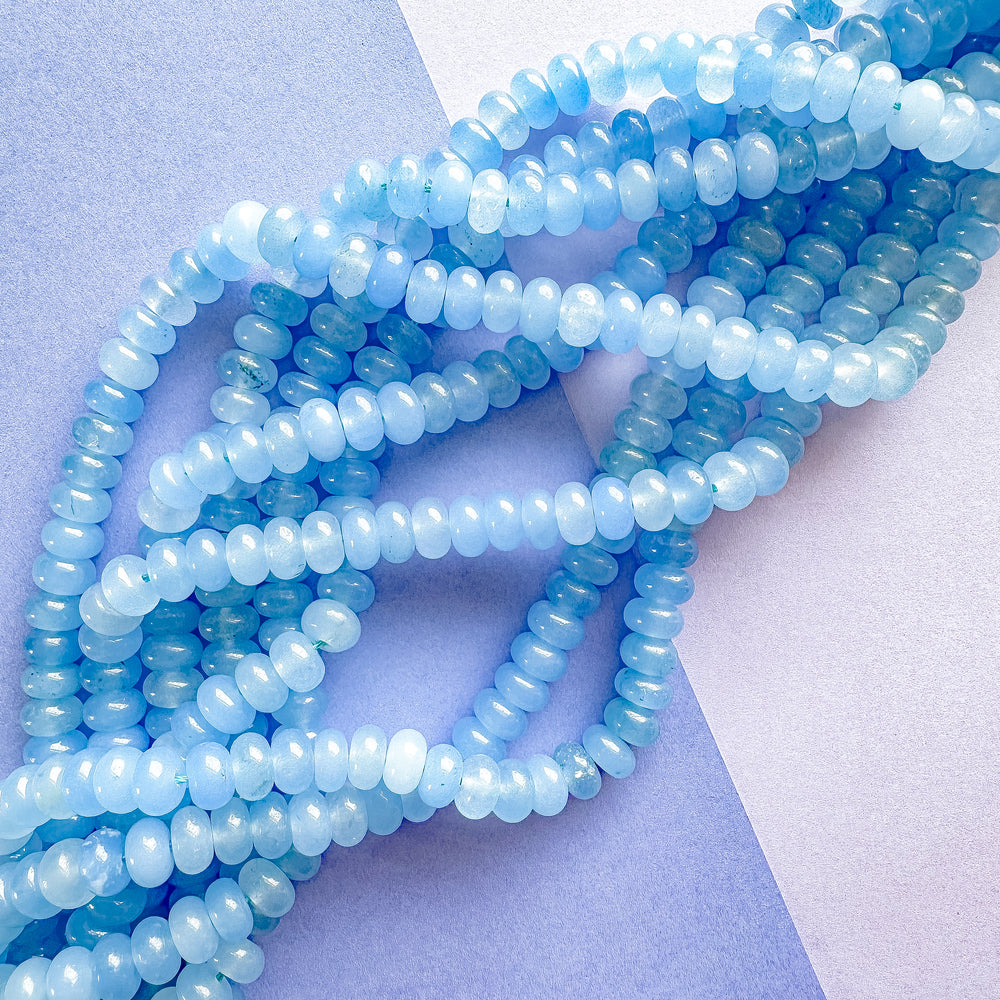 
                
                    Load image into Gallery viewer, 8mm Parisian Blue Smooth Dyed Jade Rondelle Strand
                
            