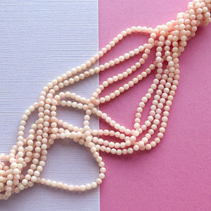 2mm Smooth Angel Skin Coral Rounds Strand