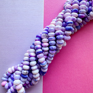 
                
                    Load image into Gallery viewer, 7mm Smooth Varigated Violet Dyed Opal Rondelle Strand
                
            