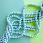 8mm Opaque Sky Blue Faceted Crystal Strand