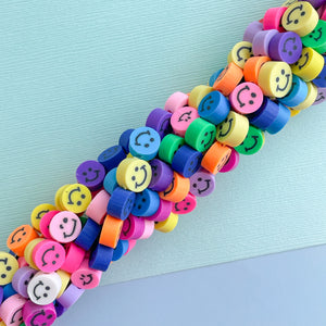 
                
                    Load image into Gallery viewer, 10mm Rainbow Smiley Face Polymer Strand
                
            