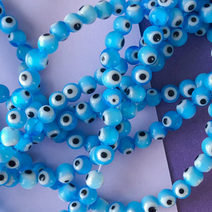
                
                    Load image into Gallery viewer, 8mm Light Blue Evil Eye Glass Sphere Strand
                
            