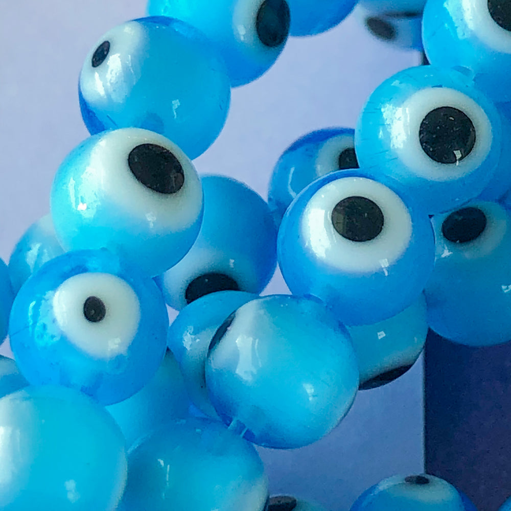 
                
                    Load image into Gallery viewer, 8mm Light Blue Evil Eye Glass Sphere Strand
                
            