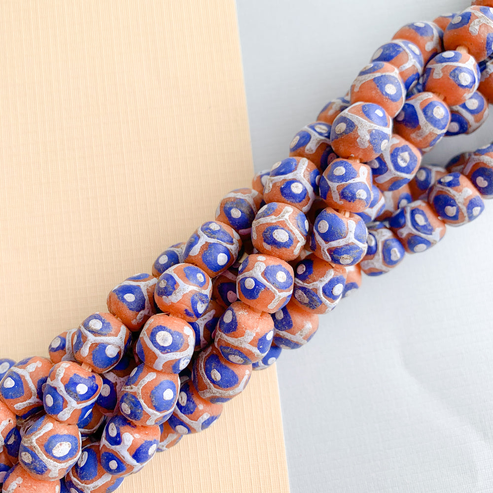 
                
                    Load image into Gallery viewer, 12mm Blue Spotted Orange Krobo Ghana Glass Strand - Beads, Inc.
                
            