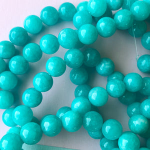 
                
                    Load image into Gallery viewer, 10mm Cyan Dyed Jade Round Strand
                
            