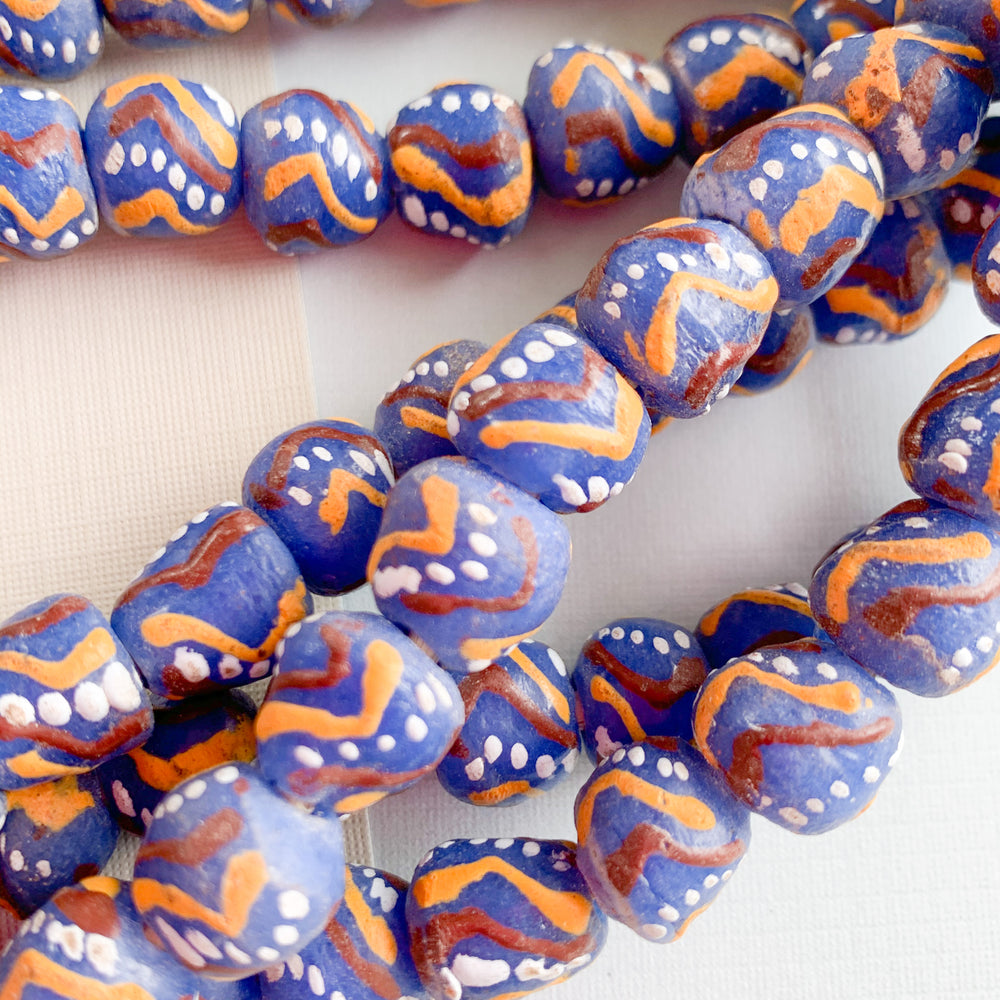 
                
                    Load image into Gallery viewer, 10mm Accented Blue Krobo Ghana Glass Strand - Beads, Inc.
                
            