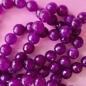
                
                    Load image into Gallery viewer, 10mm Orchid Dyed Jade Faceted Round Strand
                
            