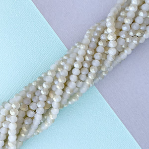 
                
                    Load image into Gallery viewer, 4mm Matte Arctic White Two-Tone Faceted Chinese Crystal Rondelle Strand
                
            
