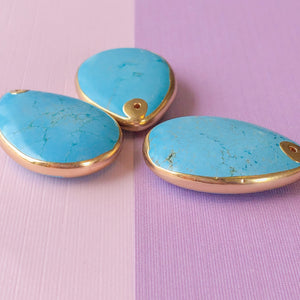 
                
                    Load image into Gallery viewer, 35mm Turquoise Howlite Gold Trim Pendant
                
            