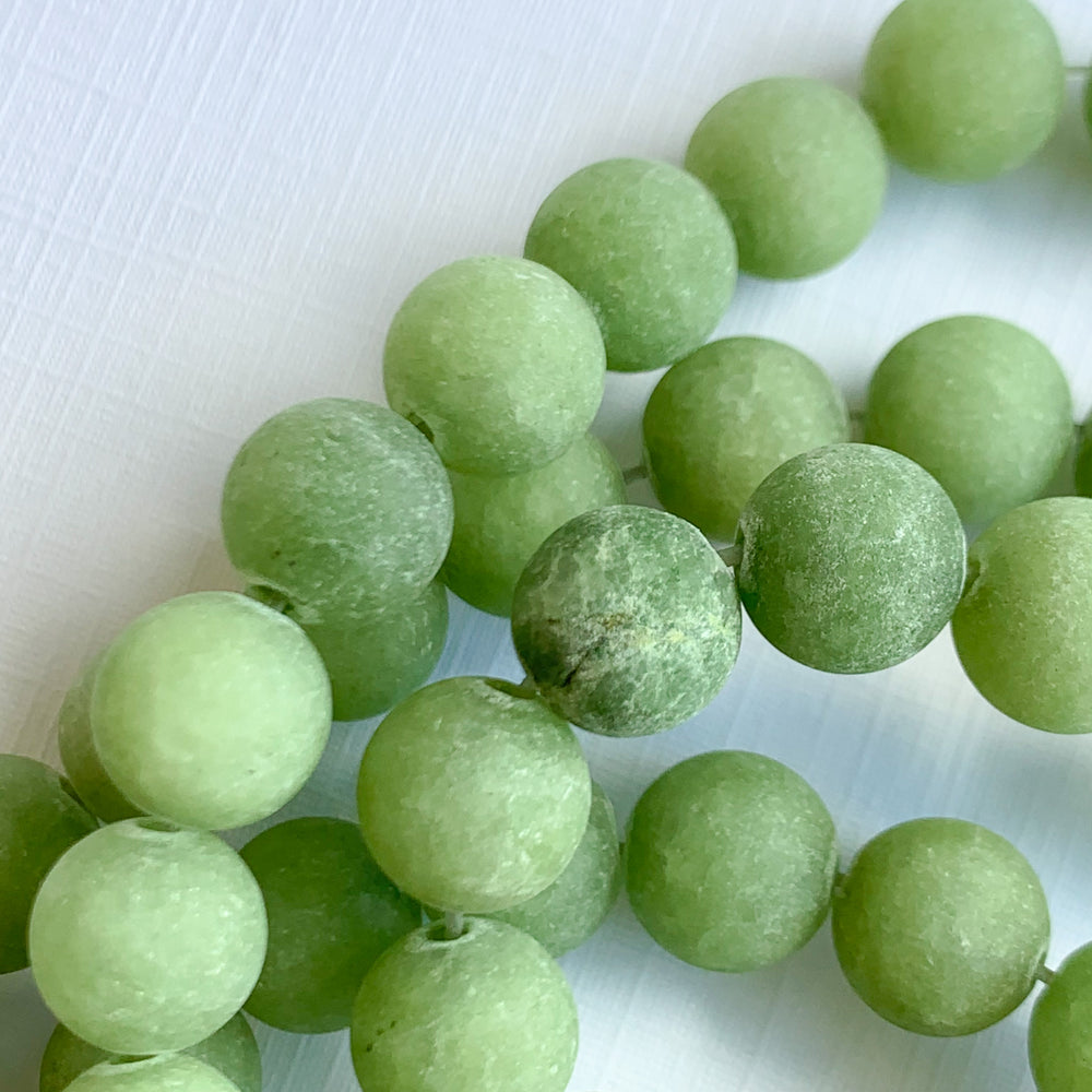 
                
                    Load image into Gallery viewer, 8mm Matte Moss Dyed Jade Rounds Strand
                
            