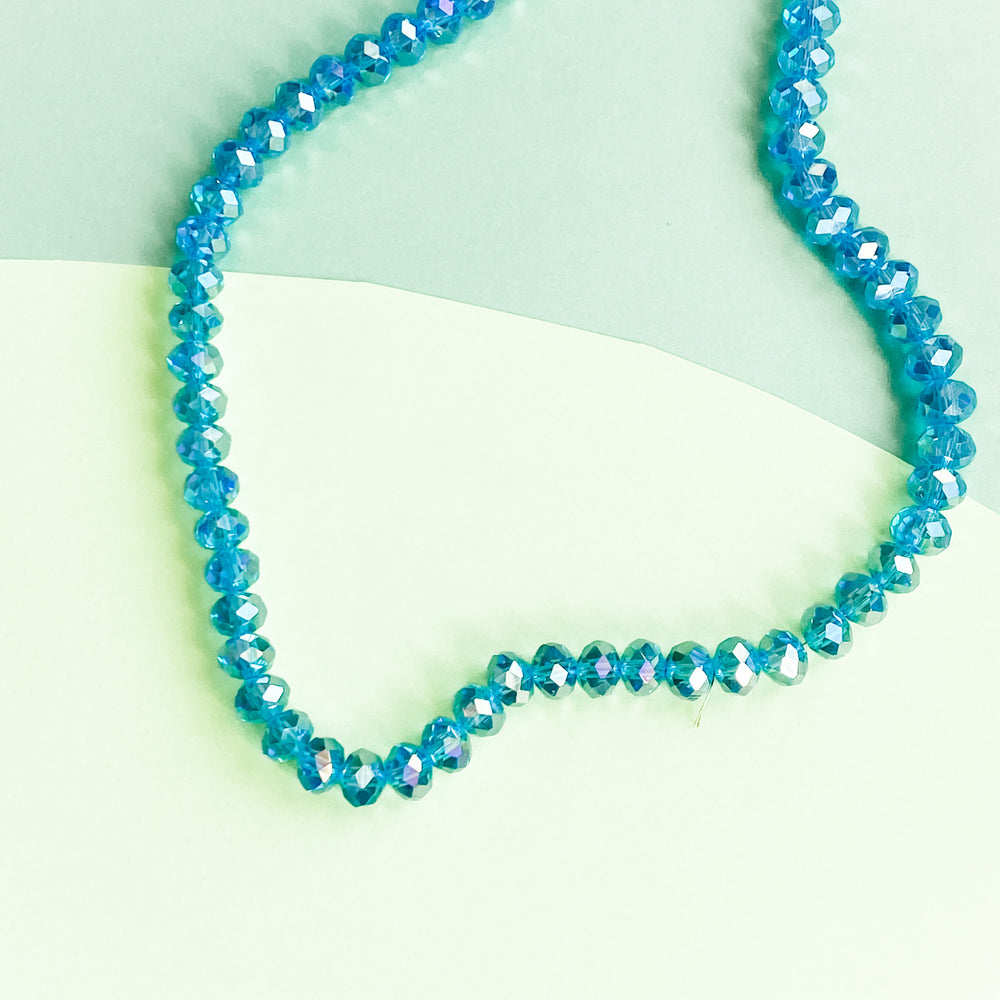 
                
                    Load image into Gallery viewer, 8mm Mermaid Blue Faceted Crystal Rondelle Strand
                
            